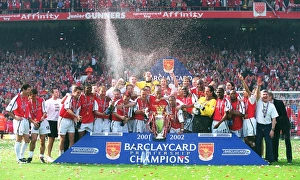The Arsenal team celebrate winning the F. A. Barclaycard Premiership