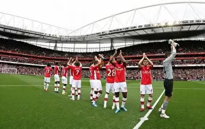 Images Dated 17th October 2009: The Arsenal team clap the fans before the match