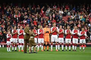The Arsenal team clap the soldiers with the rememberance reef before the match. Arsenal 2