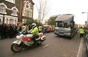 The Arsenal Team Coach arrives outside the East Stand on Avenell Road with a police escort