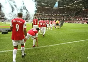 The Arsenal team walk out for the match