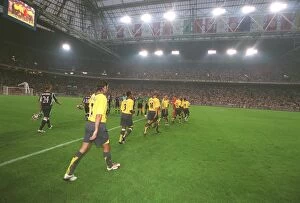 The Team Collection: The Arsenal team walk out onto the pitch. Ajax 0: 1 Arsenal