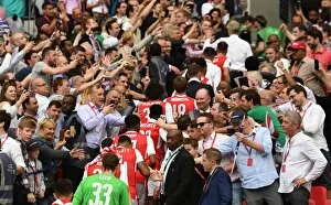 The Arsenal team walk up the wembley steps
