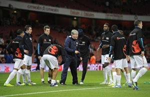 The Arsenal team warm up before the Barclays Premier League match between Arsenal The Arsenal team warm up before the Barclays Premier League match between Arsenal