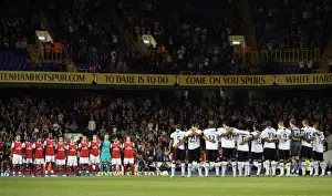 Arsenal and Tottenham players observe a minutes applause for Tottenham player Bobby Smith