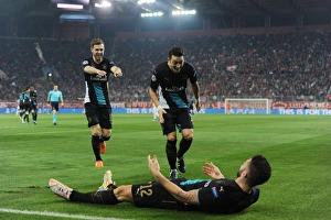 Olympiacos V Arsenal 2015-16 Prints: Arsenal Triumph: Giroud, Ozil, Ramsey Celebrate Goals Against Olympiacos in UEFA Champions League (December 2015)