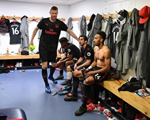 Arsenal Triumph: Mertesacker, Mkhitaryan, Aubameyang in the Aftermath of Huddersfield Victory