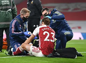 Arsenal v Wolverhampton Wanderers: David Luiz Receives Treatment Amidst Empty Emirates Stadium (2020-21)