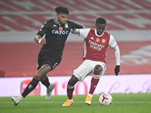 Arsenal vs Aston Villa: Eddie Nketiah vs Tyrone Mings - Premier League Clash Amidst Empty Emirates Stadium (November 2020)