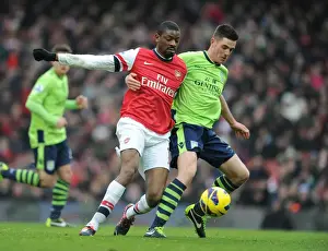 Arsenal V Aston Villa - 2012-13 Prints: Arsenal vs. Aston Villa: Abou Diaby and Ciaran Clark's Intense Clash on the Emirates Field