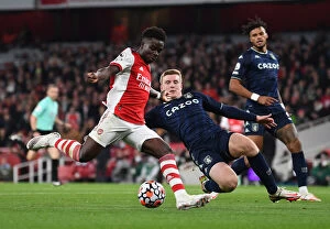 Arsenal v Aston Villa 2021-22 Collection: Arsenal vs Aston Villa: Bukayo Saka vs Matt Targett Battle at Emirates Stadium