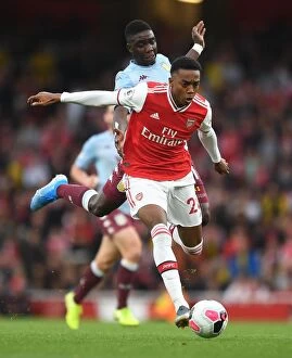 Arsenal v Aston Villa 2019-20 Collection: Arsenal vs Aston Villa: Joe Willock Clashes with Marvelous Nakamba in Premier League Showdown