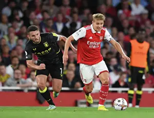 Arsenal vs Aston Villa: Martin Odegaard Clashes with John McGinn in Premier League Showdown (2022-23)