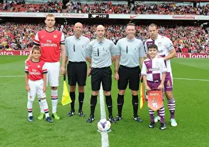 Arsenal V Aston Villa 2013-14 Prints: Arsenal vs. Aston Villa: Per Mertesacker and Ron Vlaar Lead Teams Out at Emirates Stadium