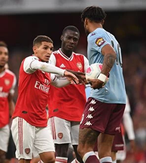Arsenal v Aston Villa 2019-20 Collection: Arsenal vs Aston Villa: Torreira and Pepe Battle Mings in Premier League Clash