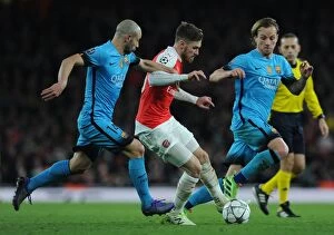 Arsenal v Barcelona 2015/16 Collection: Arsenal vs. Barcelona: A Tense Champions League Battle, 2016 - Ramsey Faces Mascherano and Rakitic