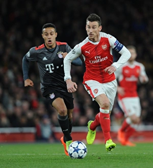 Arsenal V Bayern Munich 2016-17 Prints: Arsenal vs. Bayern Munich: Koscielny vs. Thiago in UEFA Champions League Showdown