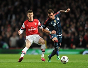 Arsenal V Bayern Munich 2013-14 Prints: Arsenal vs. Bayern Munich: Koscielny vs. Mandzukic in Intense UEFA Champions League Clash