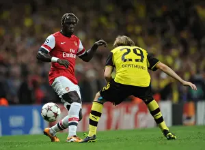Arsenal V Borussia Dortmund 2013-14 Prints: Arsenal vs. Borussia Dortmund: Clash of Sagna and Schelzer in the 2013-14 UEFA Champions League