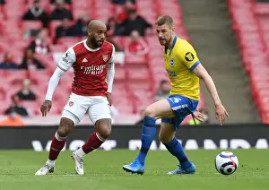 Arsenal vs Brighton: Lacazette Evades Defender Amidst Premier League Tussle (2020-21)