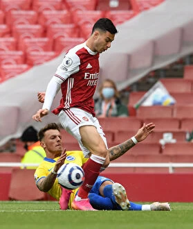 Arsenal v Brighton & Hove Albion 2020-21 Collection: Arsenal vs Brighton: Magalhaes Tackled by White in Intense Premier League Clash (2020-21)