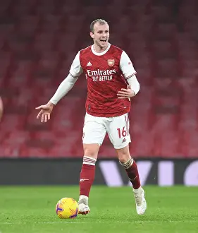 Arsenal vs Burnley: Rob Holding Amidst Limited Fan Presence in Premier League (December 2020)