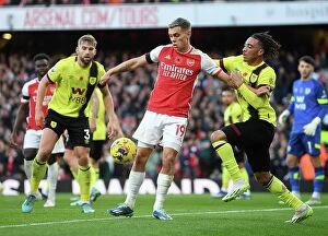 Arsenal v Burnley 2023-24 Collection: Arsenal vs Burnley: Trossard vs Koleosho - Intense Battle at Emirates Stadium