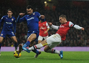 Arsenal V Cardiff City 2013-14 Prints: Arsenal vs. Cardiff: Podolski vs. Caulker in Intense Premier League Clash