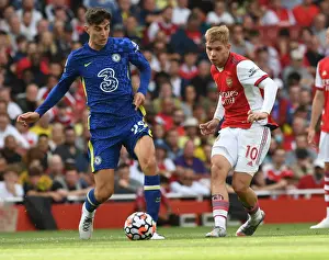 Arsenal vs. Chelsea: Emile Smith Rowe Fends Off Kai Havertz Pressure in Premier League Clash