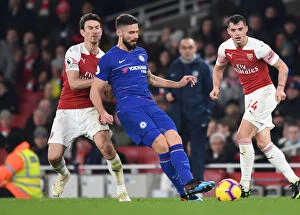 Images Dated 19th January 2019: Arsenal vs. Chelsea: Koscielny Closes In on Giroud in Intense Premier League Clash