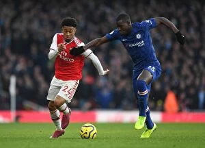 Arsenal v Chelsea 2019-20 Collection: Arsenal vs. Chelsea: Reiss Nelson Fouls by Kurt Zouma in Intense Premier League Clash (2019-20)
