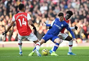 Arsenal v Chelsea 2019-20 Collection: Arsenal vs. Chelsea: Saka and Aubameyang Clash in Intense Premier League Showdown