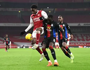 Arsenal V Crystal Palace 2020-21 Prints: Arsenal vs Crystal Palace: Bukayo Saka Faces Off Against Cheikhou Kouyate in Empty Emirates Stadium