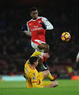 Arsenal V Crystal Palace 2016-17 Prints: Arsenal vs Crystal Palace: Intense Battle between Alex Iwobi and Joel Ward in the Premier League