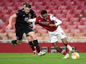 Images Dated 29th October 2020: Arsenal vs Dundalk: Joe Willock Clashes with Christopher Shields in Empty Emirates Stadium - UEFA