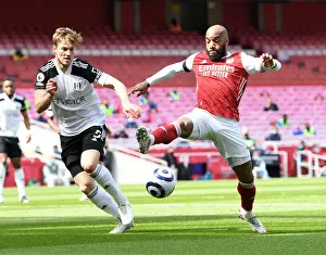 Arsenal vs Fulham: Lacazette Faces Off Against Anderson Amid Empty Emirates Stadium (April 2021)