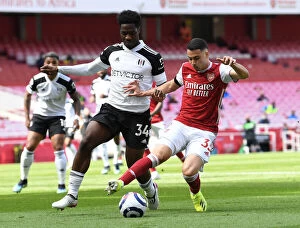 Images Dated 18th April 2021: Arsenal vs. Fulham: Martinelli Faces Off Against Aina in Empty Emirates Stadium