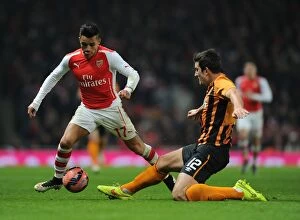 Images Dated 4th January 2015: Arsenal vs Hull City: FA Cup Clash - Alexis Sanchez vs Harry Maguire Battle
