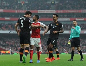 Arsenal v Hull City 2016-17 Collection: Arsenal vs Hull City: Theo Walcott Faces Off Against Maguire and Huddlestone