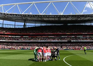 Arsenal vs Leeds United: Premier League Showdown - Arsenal Team Huddle at Emirates Stadium