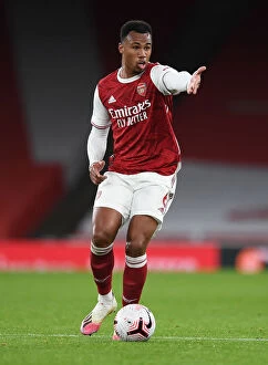 Images Dated 25th October 2020: Arsenal vs Leicester City: Gabriel Magalhaes in Action at Empty Emirates Stadium
