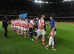 Arsenal V Leicester City 2014-15 Prints: Arsenal vs Leicester City: Per Mertesacker and Matthew Upson Exchange Handshakes Before Kick-off (2015)
