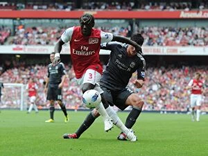 Images Dated 20th August 2011: Arsenal vs. Liverpool: Bacary Sagna vs. Martin Kelly Clash at the Emirates, 2011-2012 Premier League