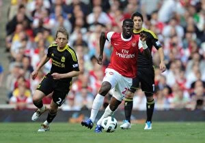 Images Dated 17th April 2011: Arsenal vs. Liverpool: Eboue vs. Leiva - Barclays Premier League Rivalry (April 17, 2011)