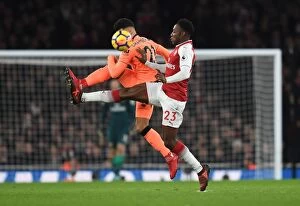 Arsenal v Liverpool 2017-18 Collection: Arsenal vs. Liverpool: Intense Battle Between Danny Welbeck and Alex Oxlade-Chamberlain