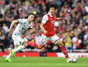 Arsenal vs Liverpool: Intense Battle - Tomiyasu vs Jota