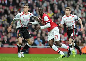 Arsenal V Liverpool - FA Cup 2013-14 Prints: Arsenal vs. Liverpool: Intense Battle Between Yaya Sanogo and Daniel Agger in the FA Cup