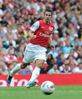 Arsenal v Liverpool 2011-2012 Collection: Arsenal vs. Liverpool: Robin van Persie Faces Off in the 2011-2012 Premier League Clash