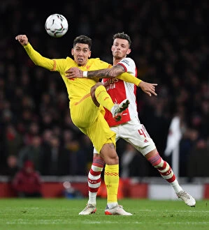 Arsenal v Liverpool Carabao Cup 2021-22 Collection: Arsenal vs Liverpool Showdown: A Battle of Wits - White vs Firmino in the Carabao Cup Semi-Finals