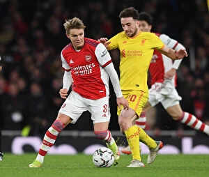 Arsenal v Liverpool Carabao Cup 2021-22 Collection: Arsenal vs Liverpool Showdown: Odegaard vs Jota Battle in Carabao Cup Semi-Finals